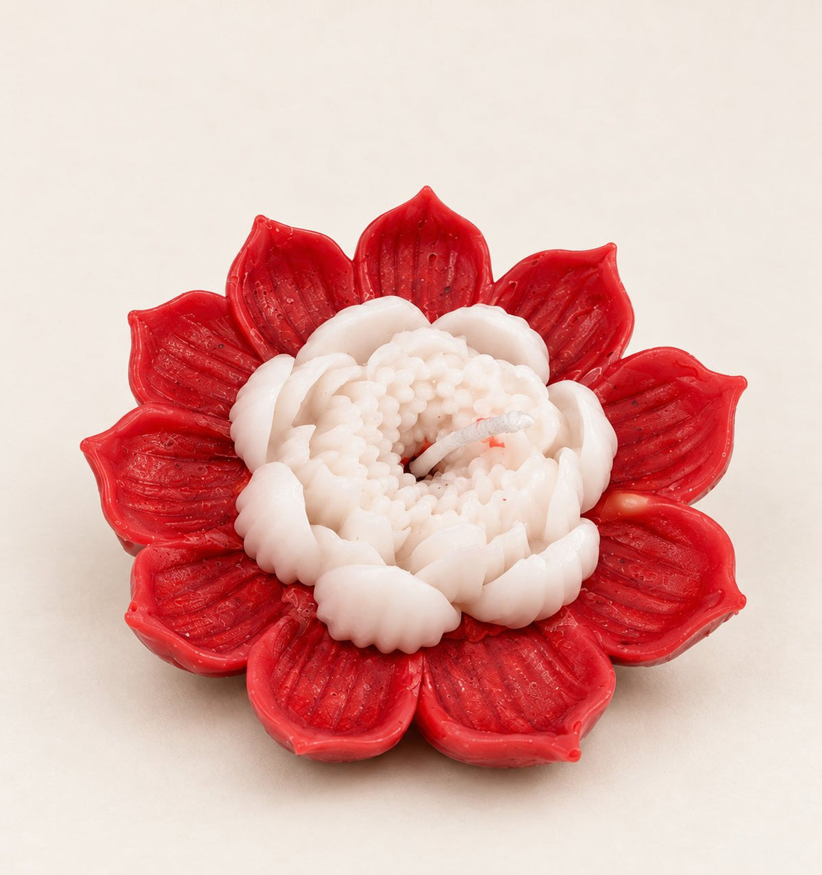 Kamal Jyoti lotus-shaped candle on a plain neutral background