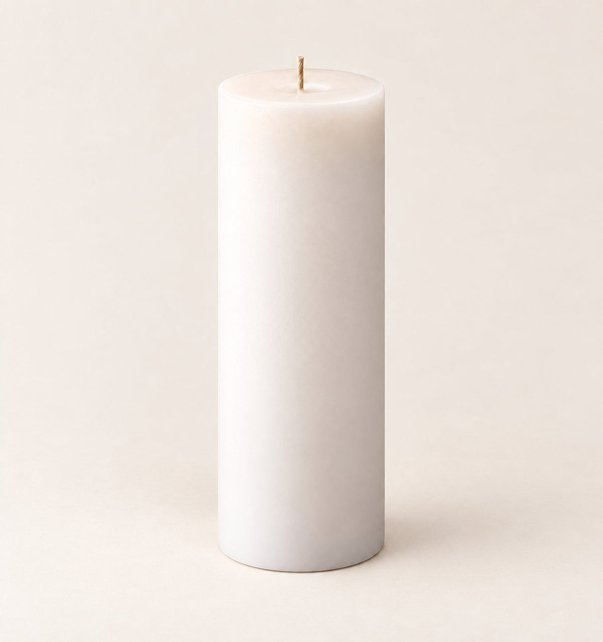 The Statement pillar candle on a plain neutral background